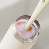 Multifunktionale Reinigungsbürste in Karottenform